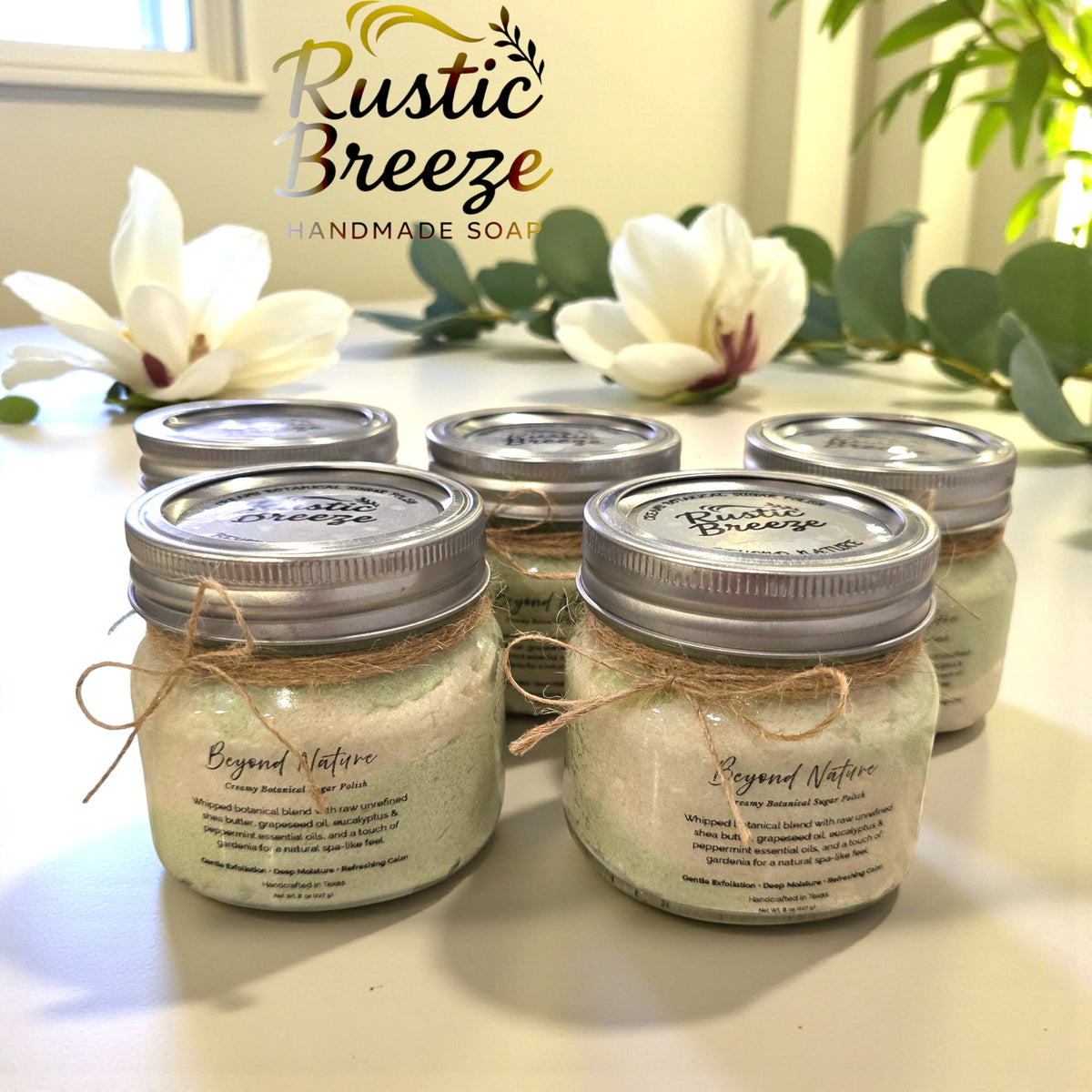 Rustic Breeze handmade soaps with Beyond Relax jars, Gentle • Calming • Nourishing, on table.