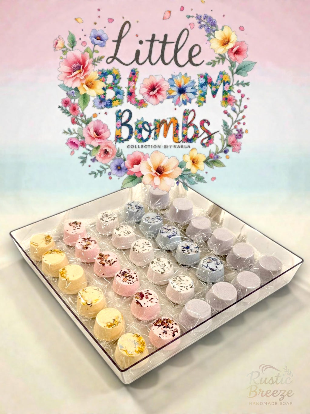 Little Bloom Bombs display with floral design and various colorful bath bombs on tray